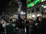 Eagles followers march on metropolis as they scale lampposts, chant &#8216;f*** the Chiefs&#8217; and face off with cops