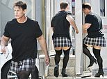 John Cena exhibits off his muscular legs in thigh high stockings on set